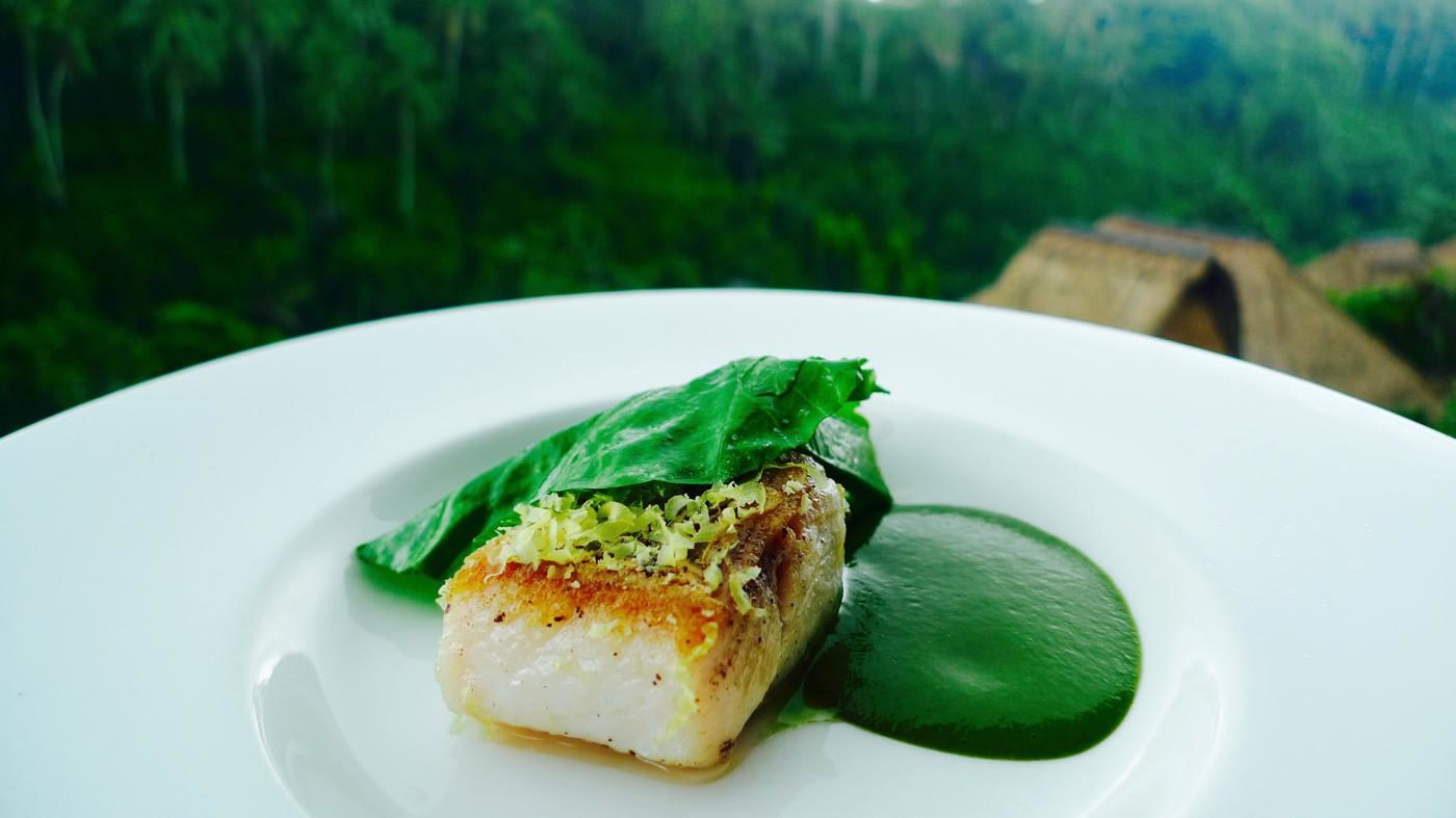 CasCades Restuarant Barramundi topped with spinach, young coconut sauce, cured egg yolk and Chinese kalian